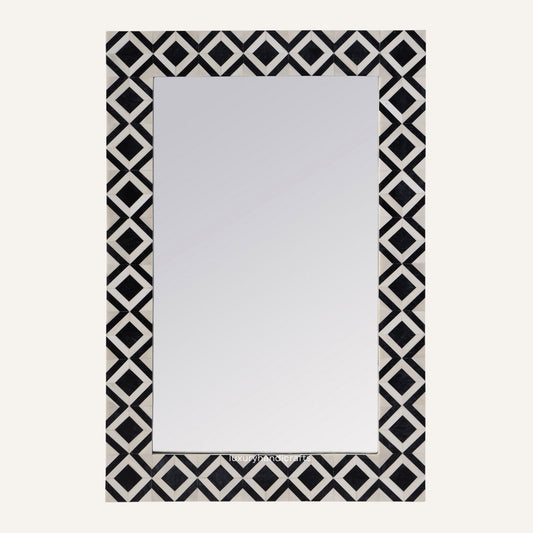 Rectangular mirror with a black and white geometric border on a white background