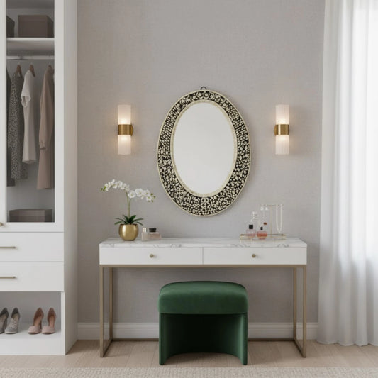 Modern bedroom with a vanity table, mirror, and green stool.