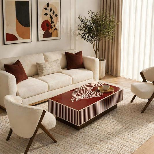 Modern living room with a white sofa, coffee table, and decorative elements.