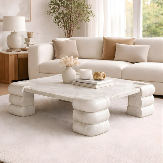 Modern living room with a white marble coffee table.