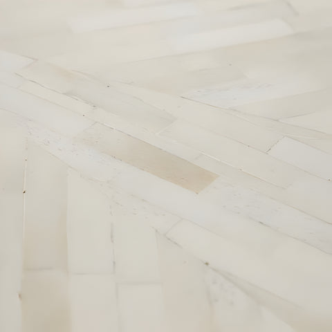 Close-up of a wooden floor with a herringbone pattern