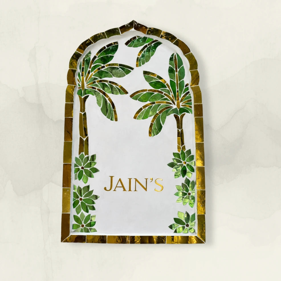 Decorative nameplate with palm tree design and name on a white background