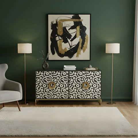 Modern living room with patterned console table, abstract art, and floor lamps.