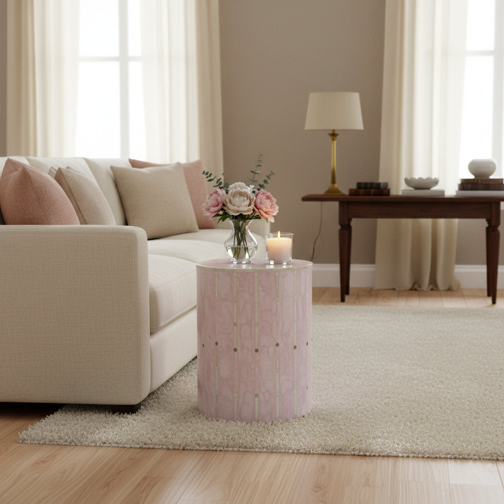 Round stool with a pink and gold pattern on a white background