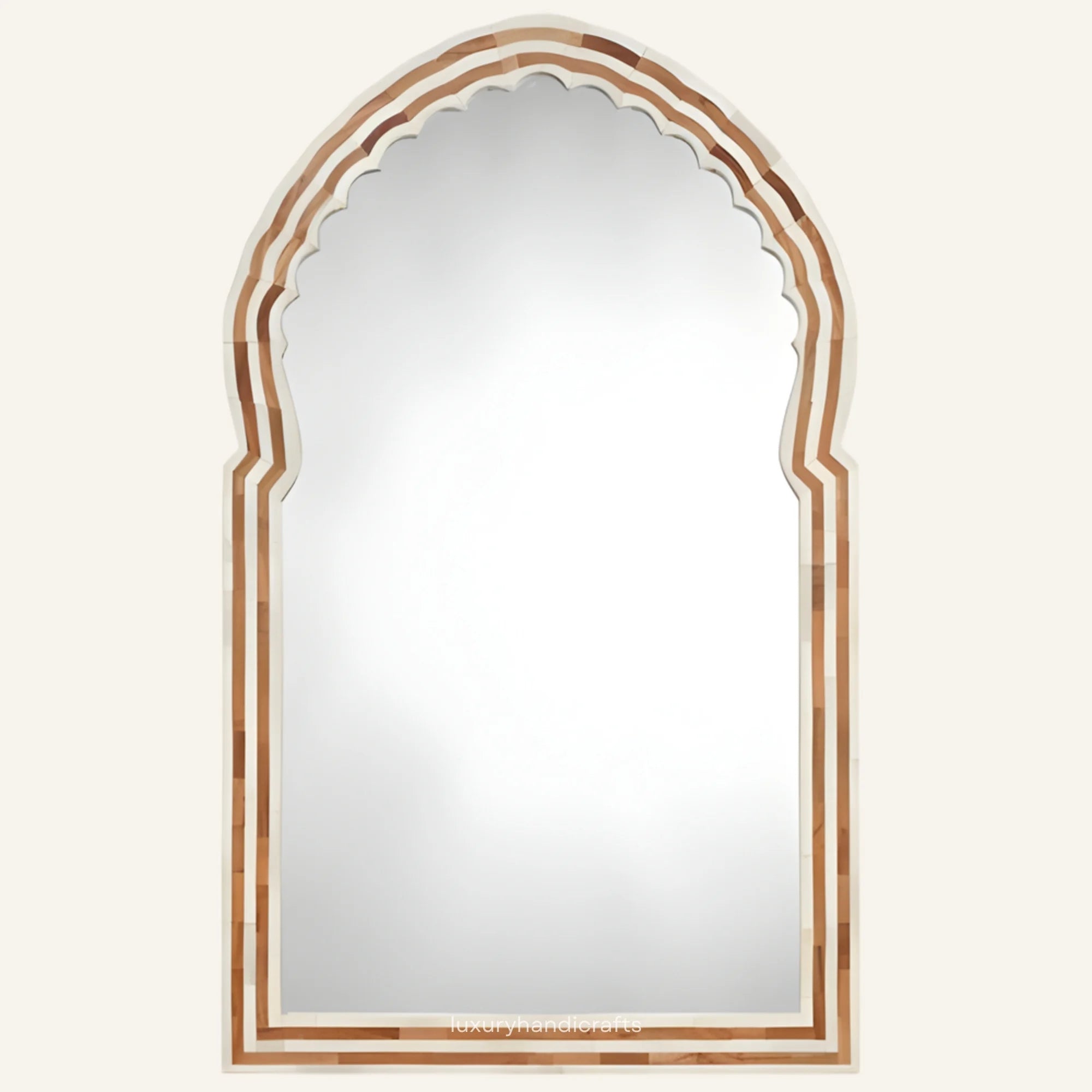 Arched mirror with decorative wooden frame on a white background