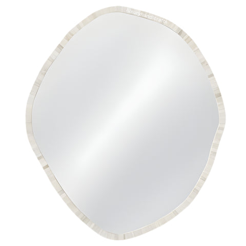 Round mirror with a beige border on a white background