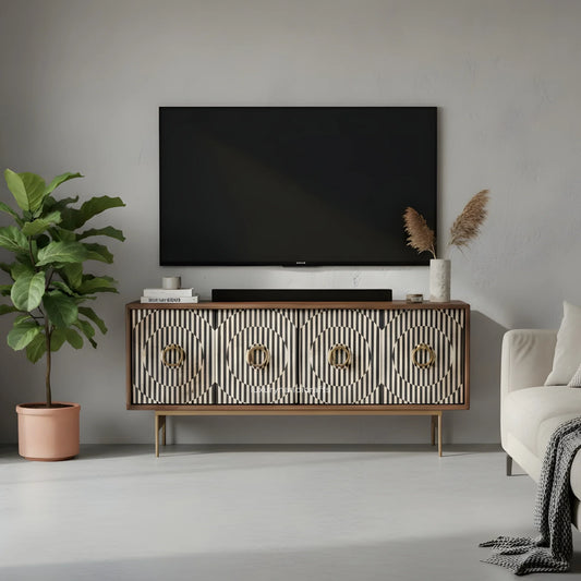 Modern living room with a tv on a decorative bone inlay media cabinet, plant, and sofa.