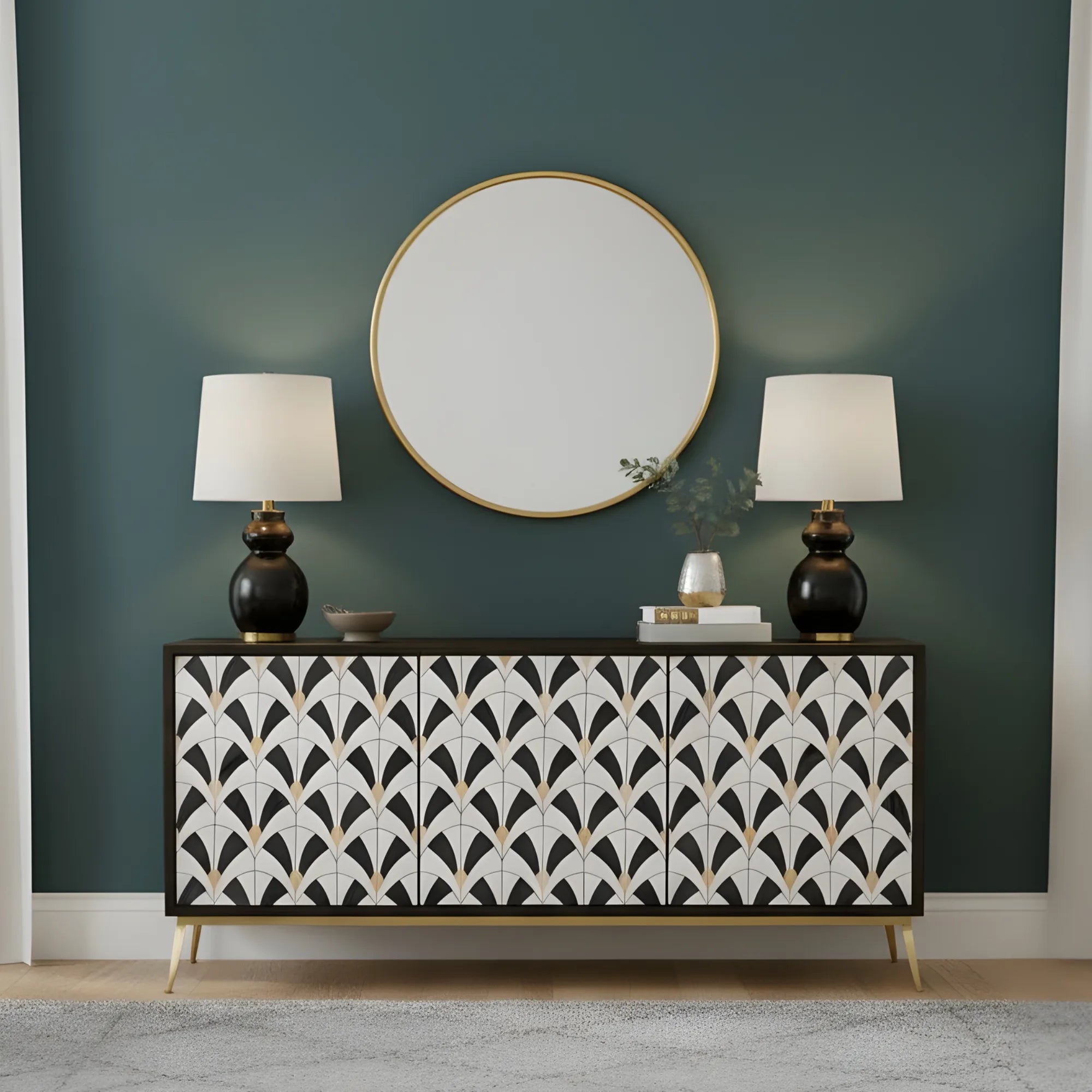 Decorative sideboard with patterned design against a green wall with a round mirror and two lamps.