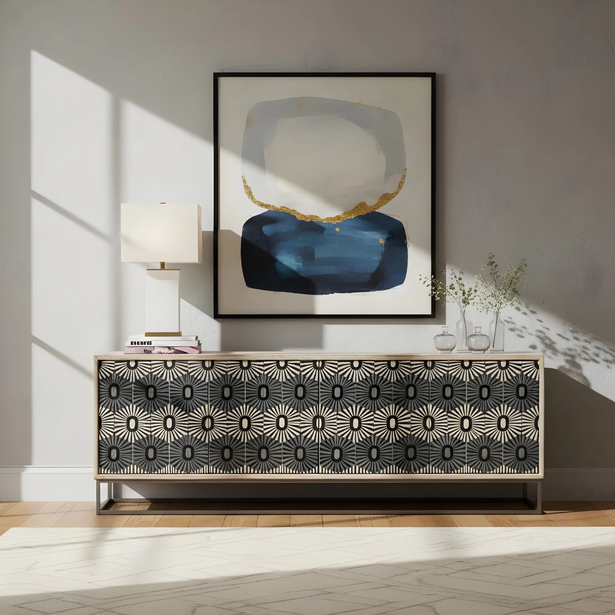 Modern interior with a patterned sideboard, abstract art, and lamp.
