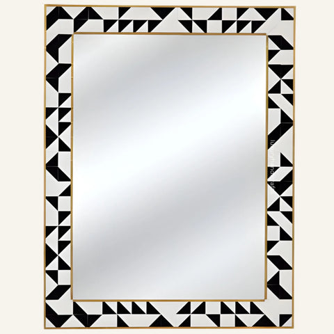 Rectangular mirror with a black and white geometric border on a white background