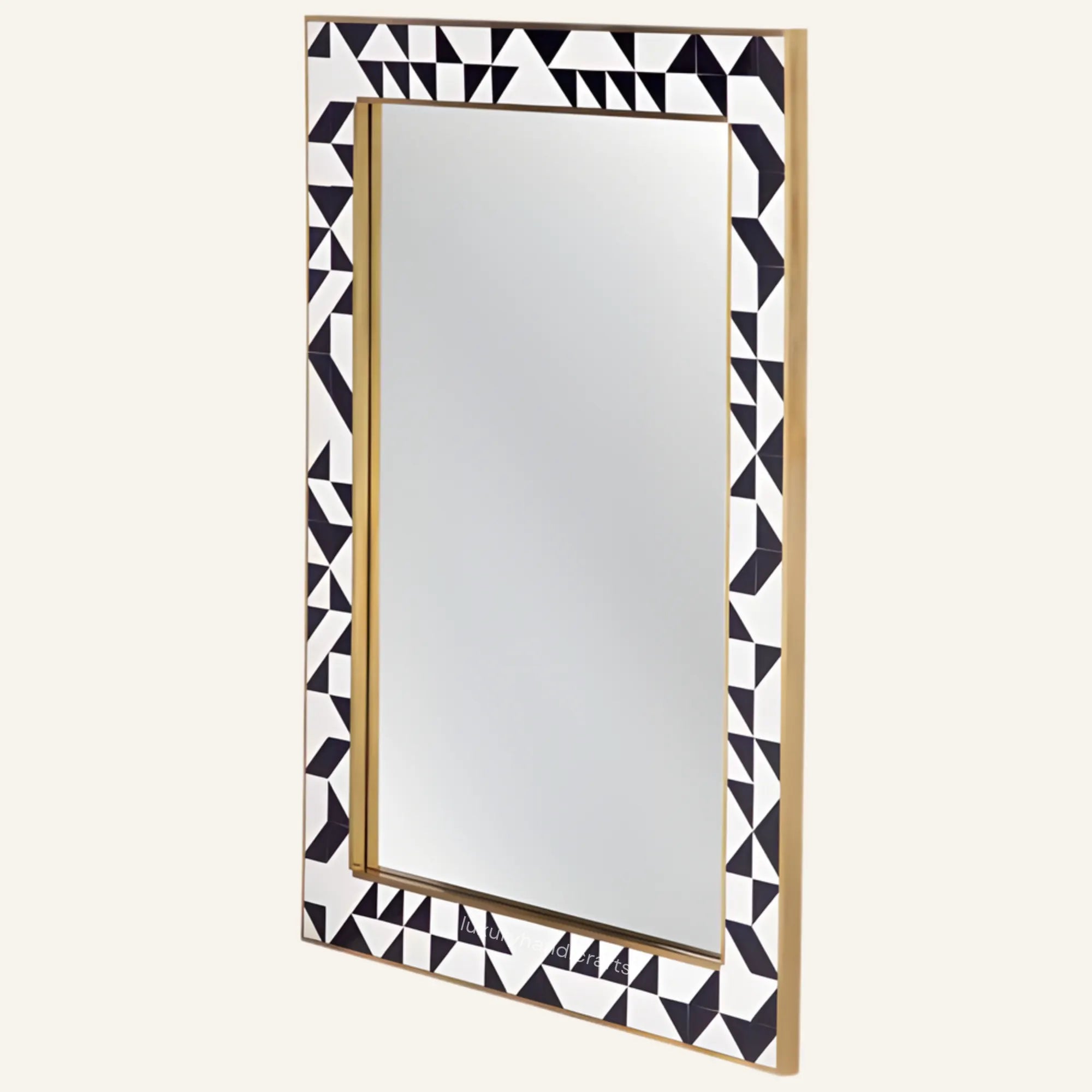 Rectangular mirror with a decorative black and white geometric frame on a white background