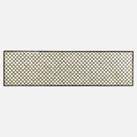 Decorative metal lattice panel on a white background