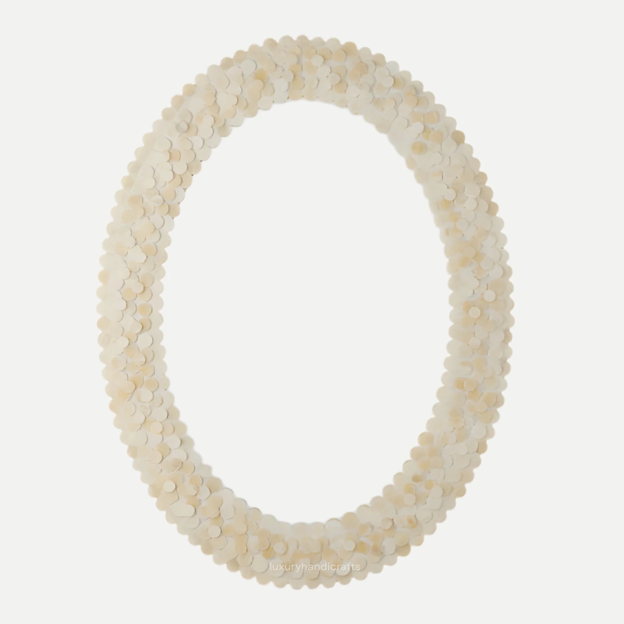 Oval mirror with a shell-like frame on a white background