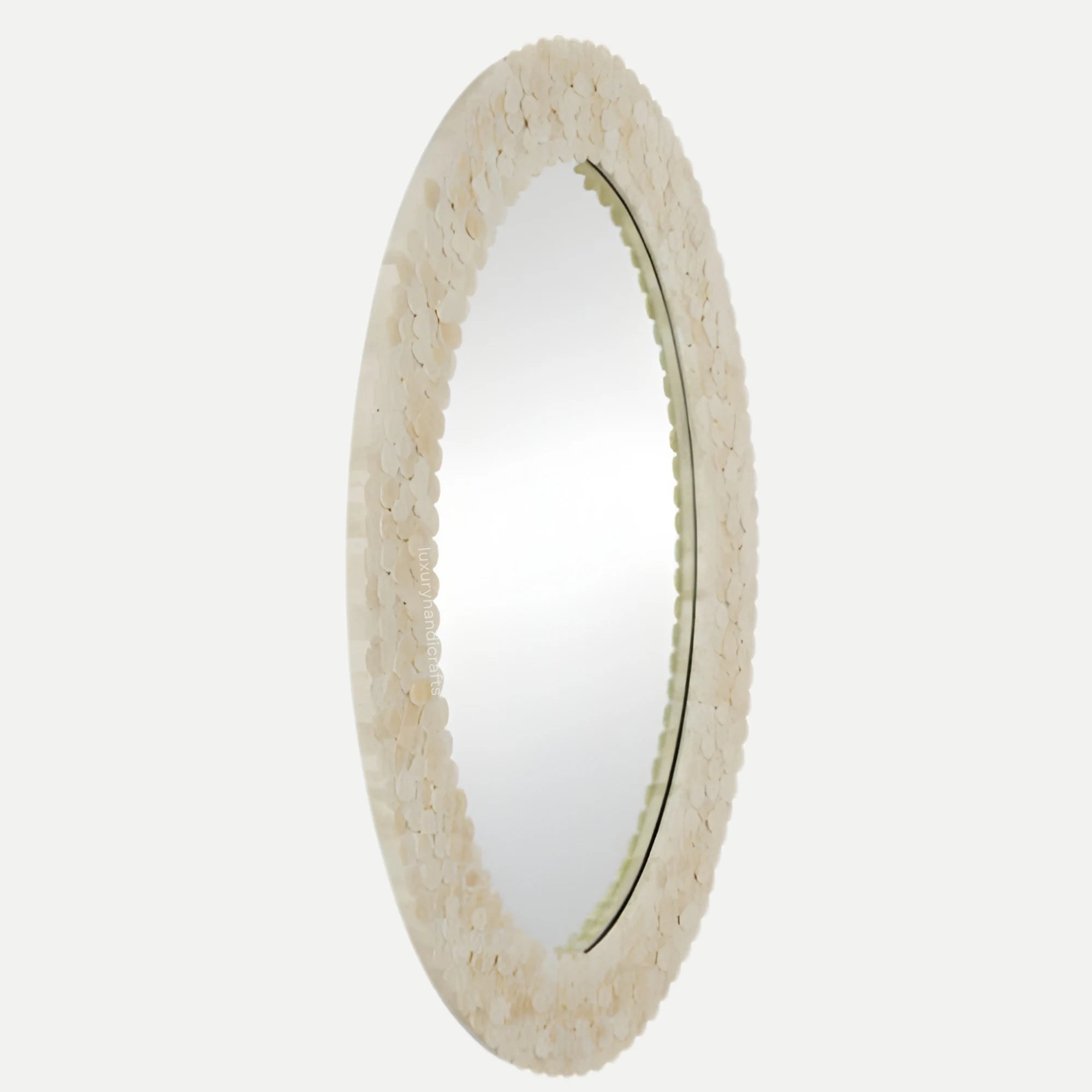 Round mirror with a textured beige frame on a white background