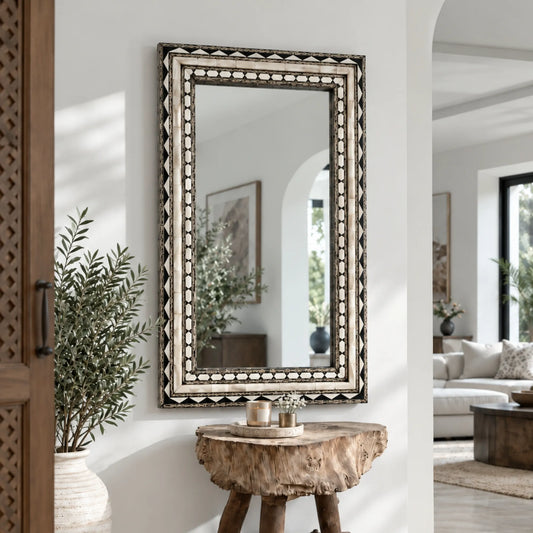Handcrafted Bone and Brass Inlay Wall Mirror featuring geometric patterns in a luxury living room entryway