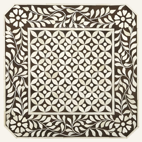 Decorative tile with geometric pattern and leaf border