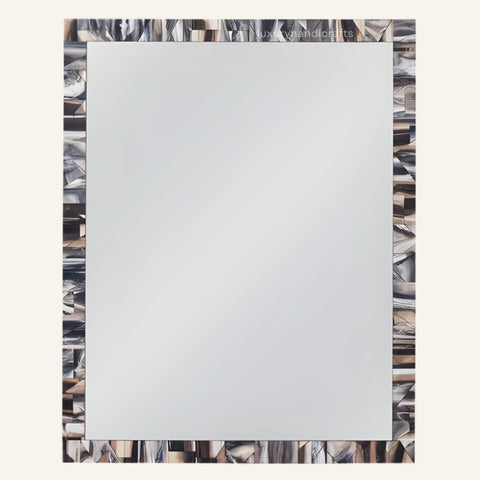 Frosted glass panel with a decorative frame featuring abstract patterns.