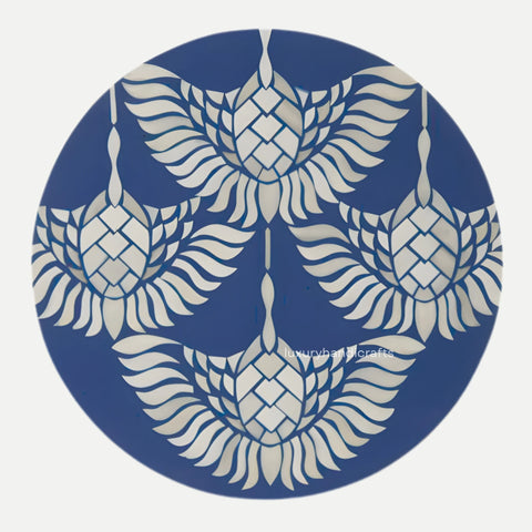 Decorative circular design with white floral patterns on a blue background