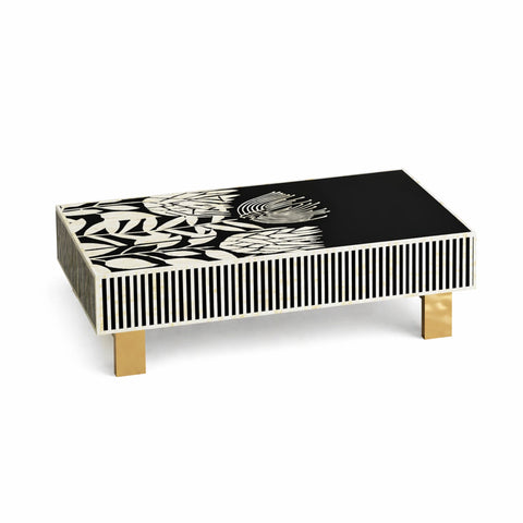Coffee table with black and white abstract design on a white background
