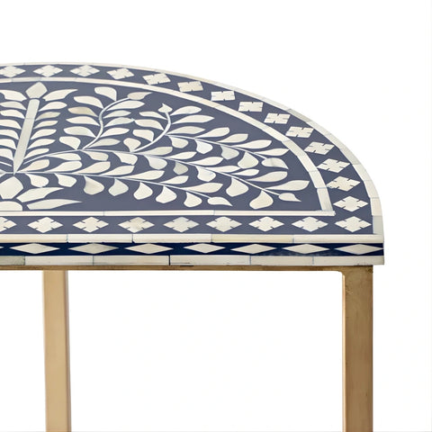 Close up of blue bone inlay floral pattern on half moon side table