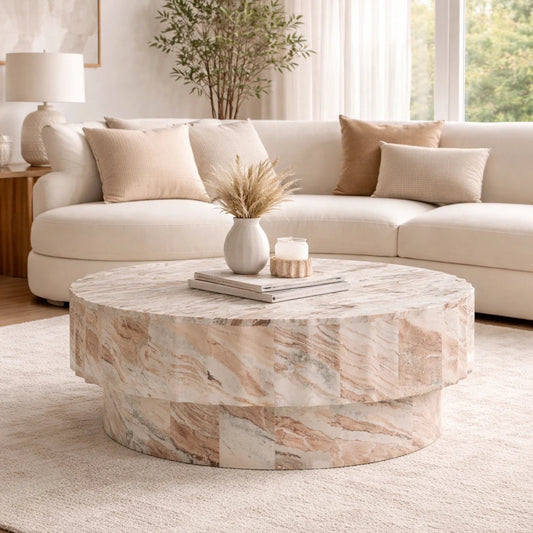 Living room with a marble coffee table, beige sofa, and decorative items.