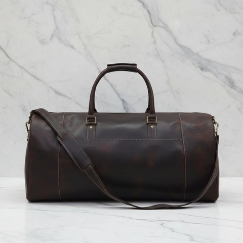 Back of the Miguel dark brown leather duffle bag with top handles and detachable shoulder strap