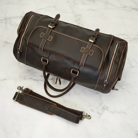 Top view of the Miguel dark brown leather duffle bag with brass fittings and matching detachable shoulder strap