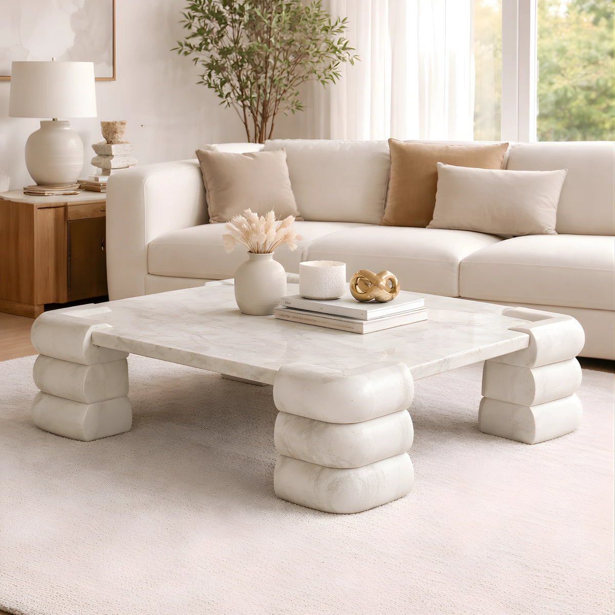 Modern living room with a white marble coffee table.